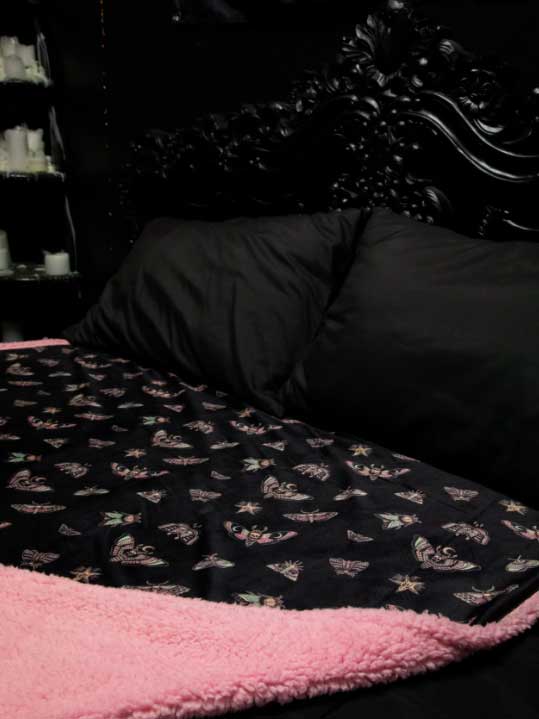 pink and black insects blanket