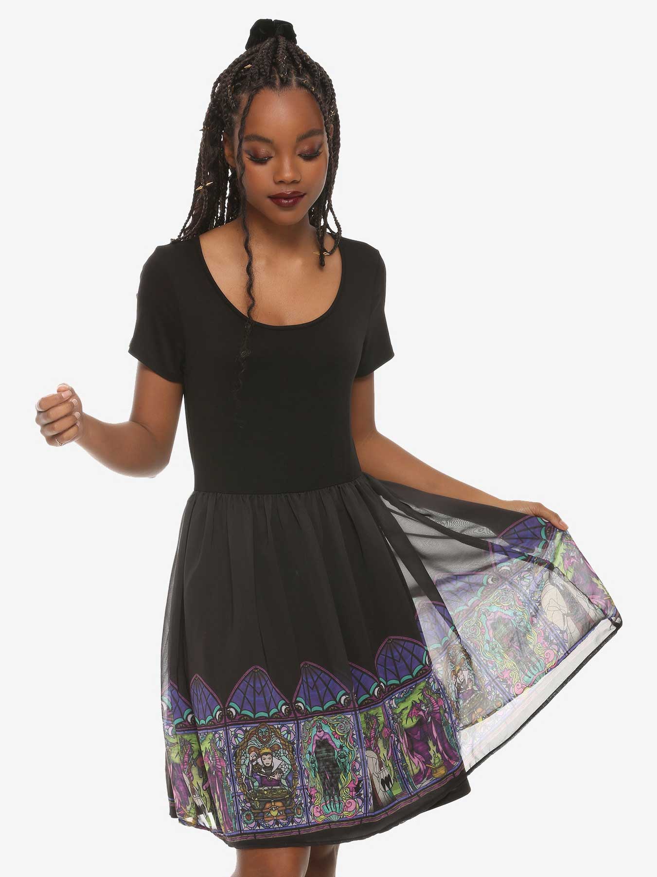 thin black dress with images around the hem