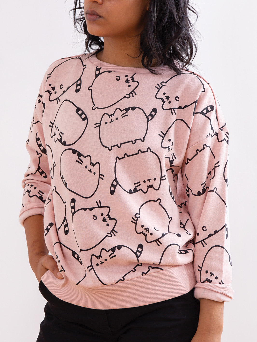 blush sweatshirt with black Pusheen cats